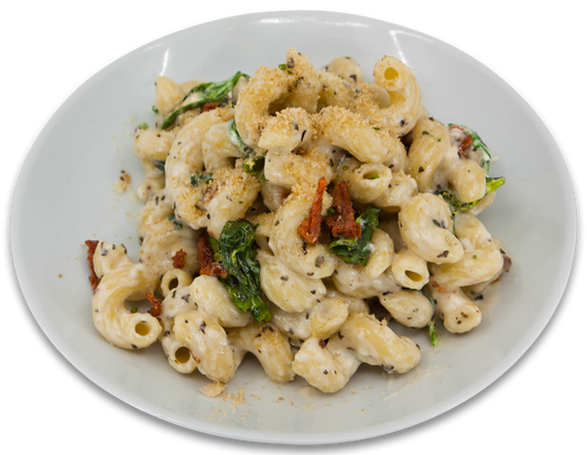 Macaroni au fromage avec tomates sechées et épinards